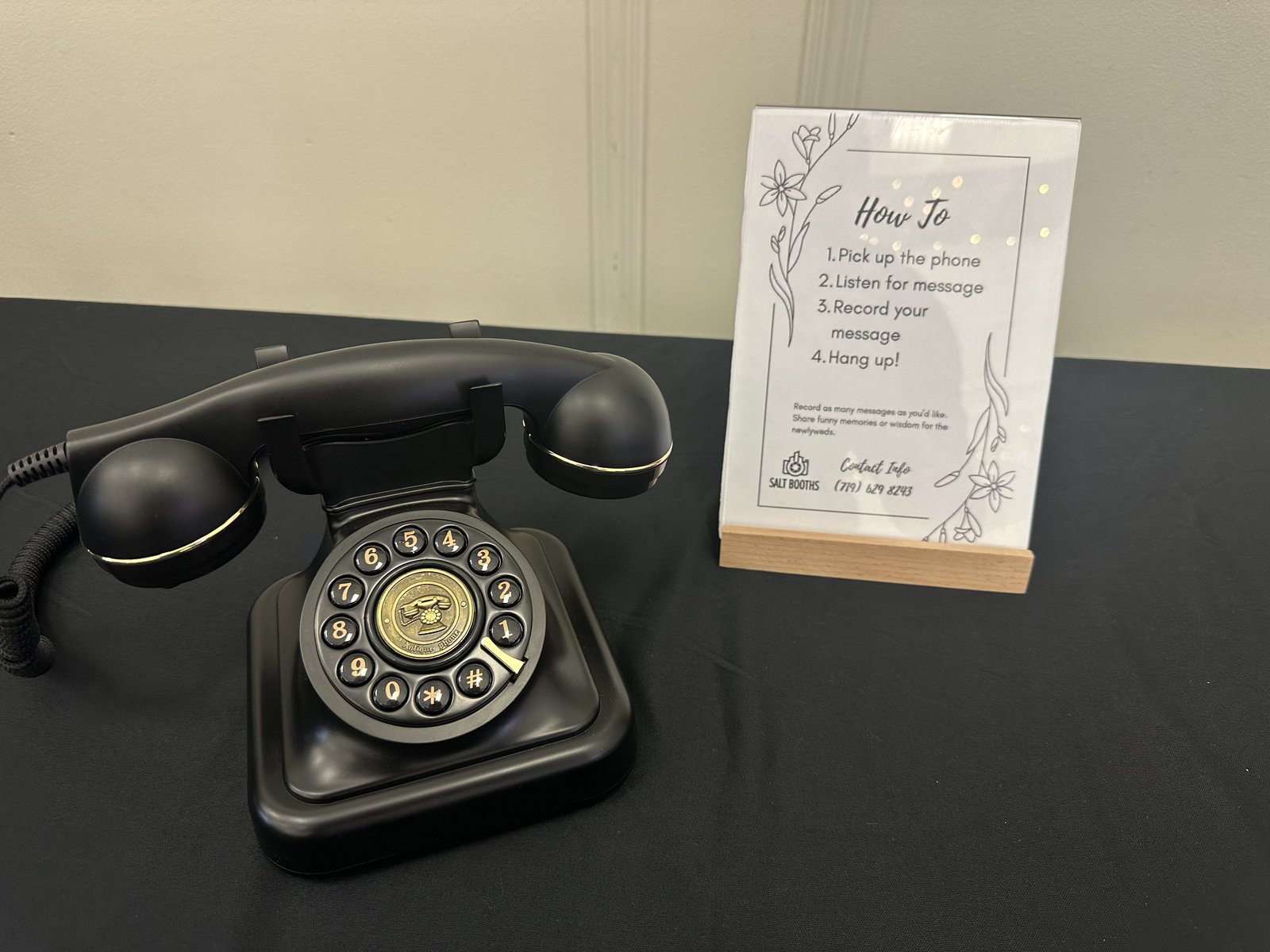Salt Booths audio guestbook — vintage black rotary phone with custom How To card showing pick up, listen, record, hang up